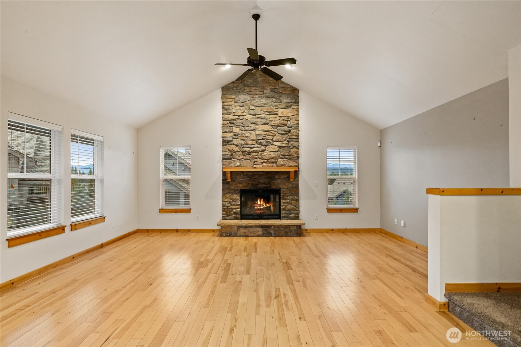 231 Clearwater Loop, Unit 1 Ronald, WA 98940 - Photo 3 of 34 a view of an empty room with wooden floor fireplace and a window