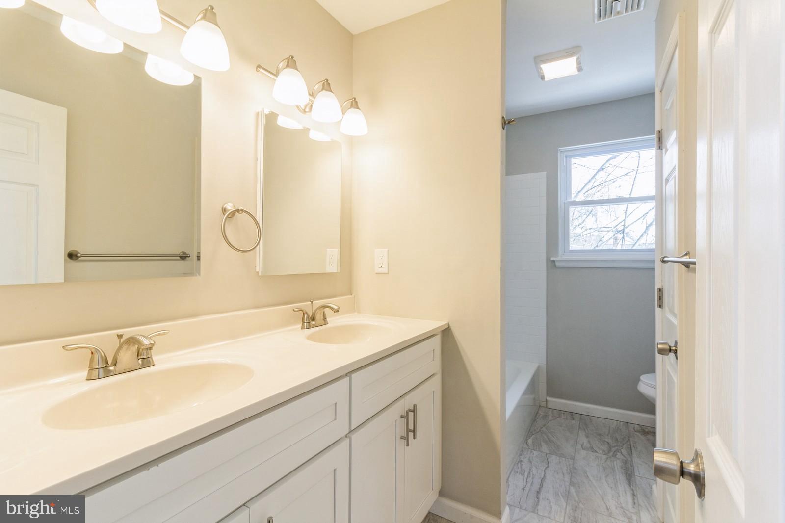 511 Schick Road Aston, PA 19014 - Photo 13 of 24 a bathroom with a sink vanity granite and a mirror