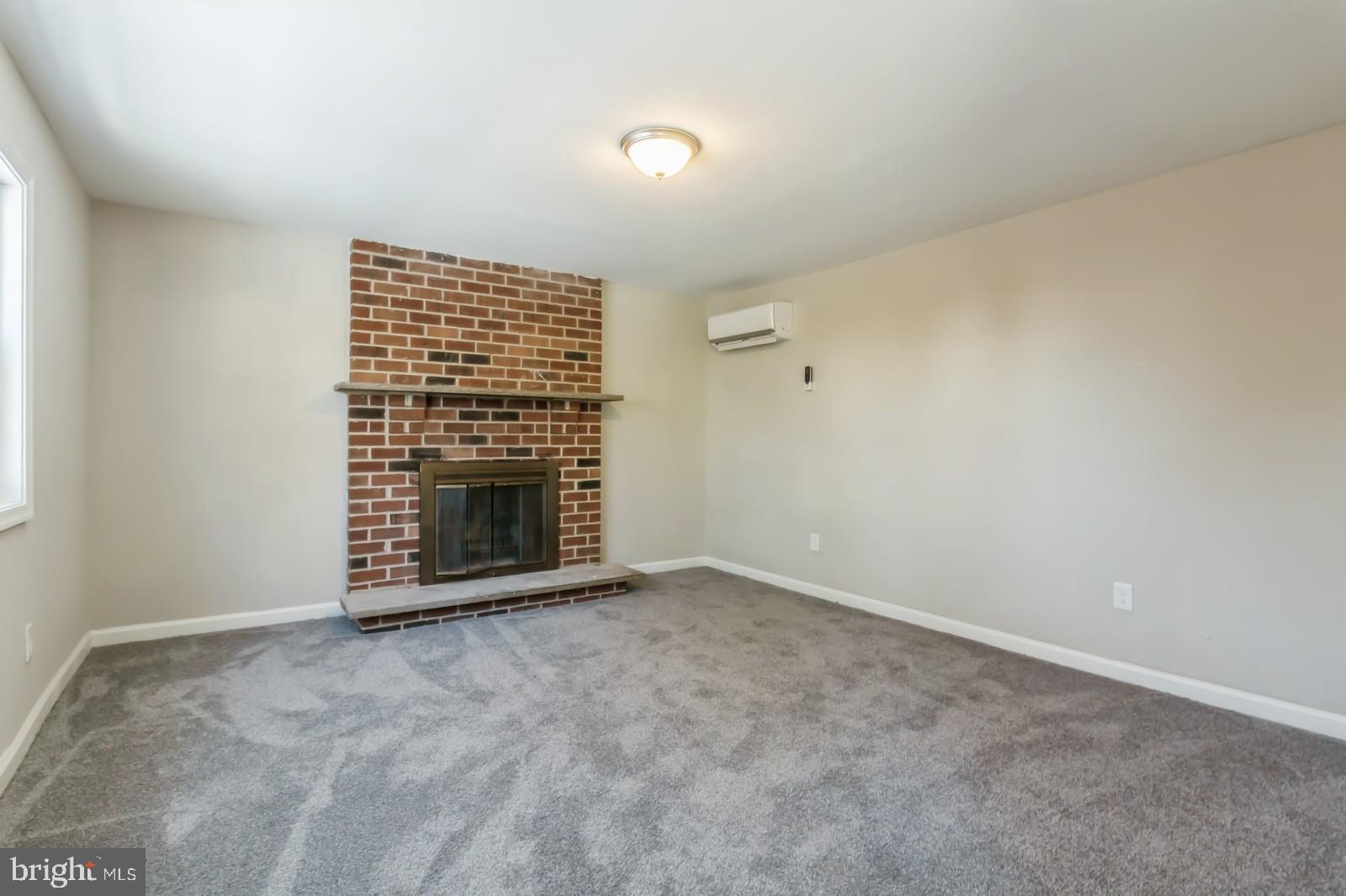 511 Schick Road Aston, PA 19014 - Photo 8 of 24 a view of an empty room with a fireplace