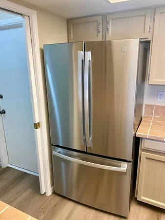 a view of a refrigerator in kitchen and a refrigerator