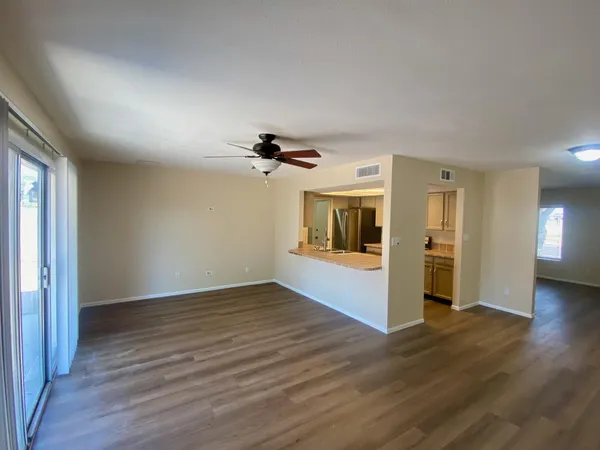 a view of a livingroom with wooden floor