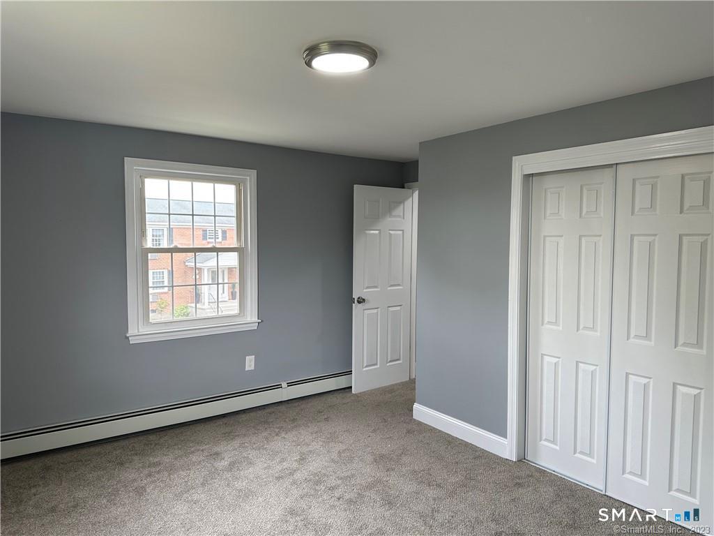 12 Brewster Road, Unit C Glastonbury, CT 06033 - Photo 7 of 10 a view of an empty room with a window