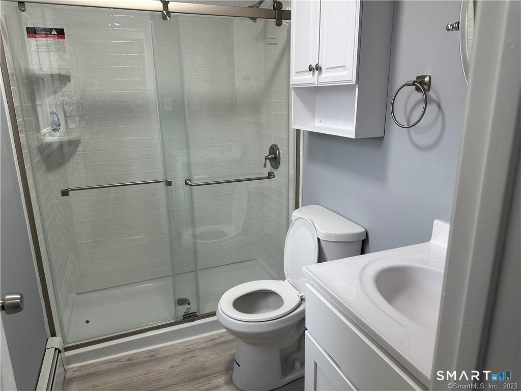 12 Brewster Road, Unit C Glastonbury, CT 06033 - Photo 9 of 10 a bathroom with a toilet and a sink