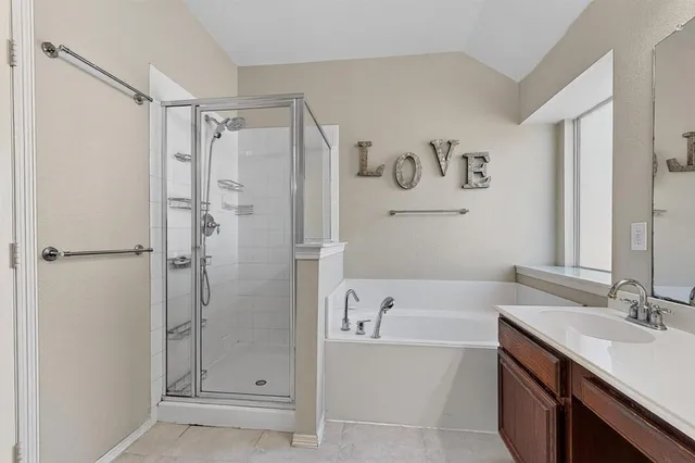 a bathroom with a bathtub and a sink