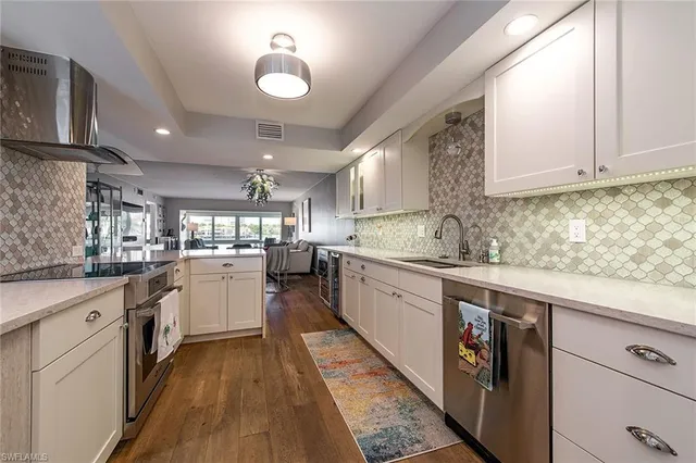 a kitchen with sink and cabinets