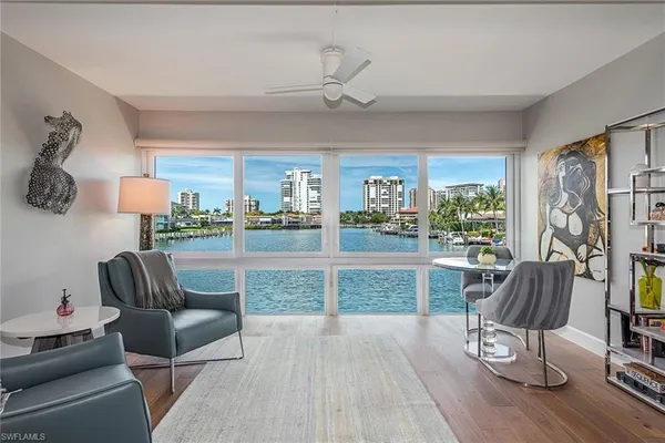a living room with furniture and a large window