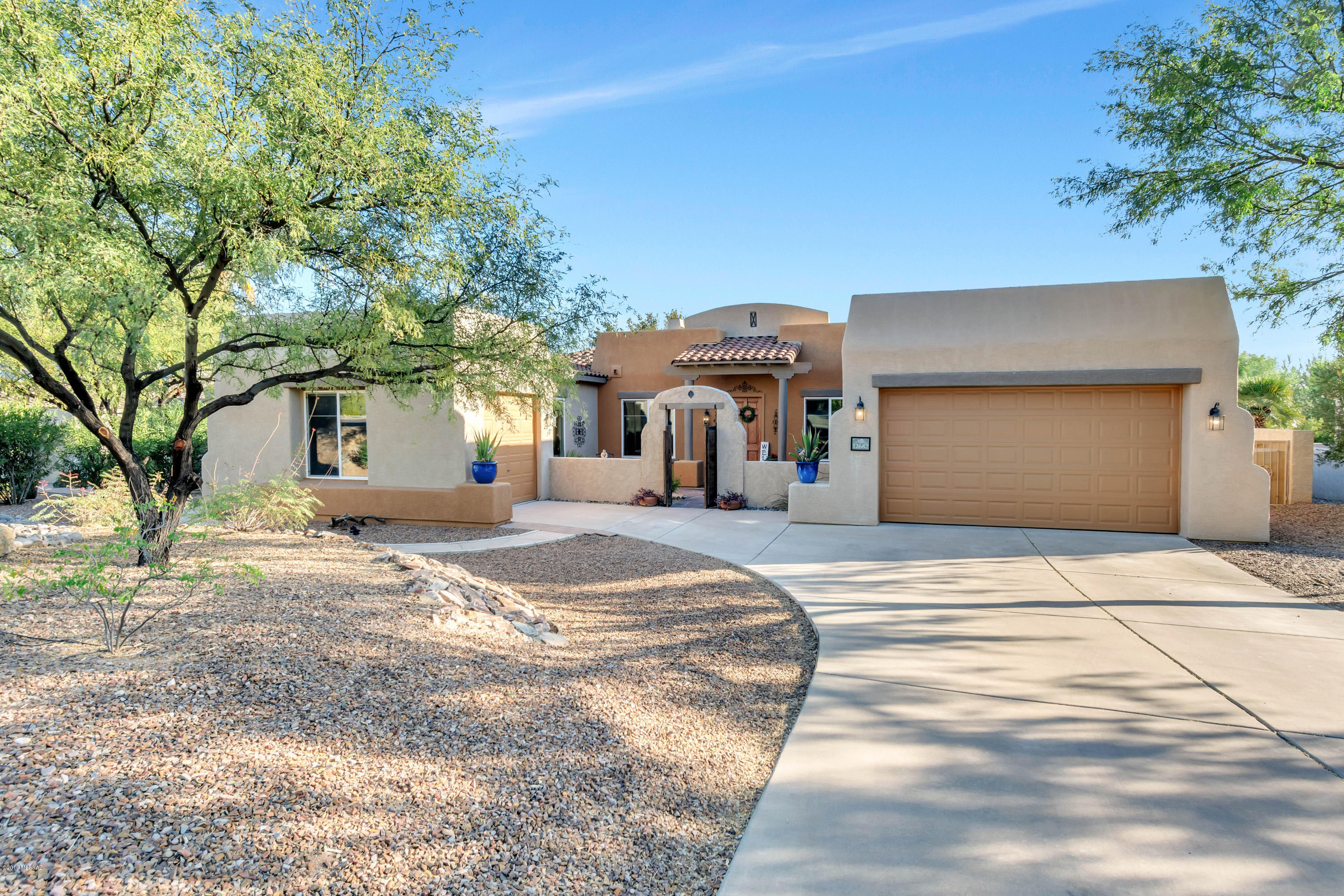 12682 North Spirit Mountain Road Oro Valley, AZ 85755 - Photo 23 of 40 a front view of a building with trees