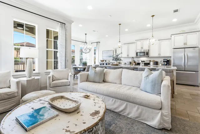 a kitchen with stainless steel appliances granite countertop a sink a stove and refrigerator