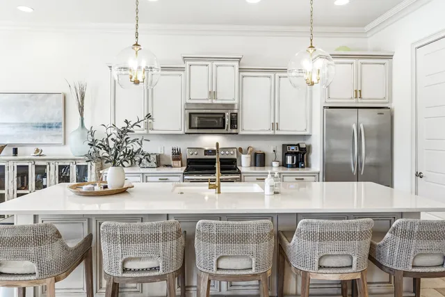 a kitchen with a sink cabinets and stainless steel appliances