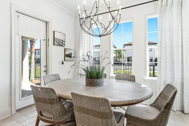a living room with stainless steel appliances kitchen island granite countertop furniture and a dining table