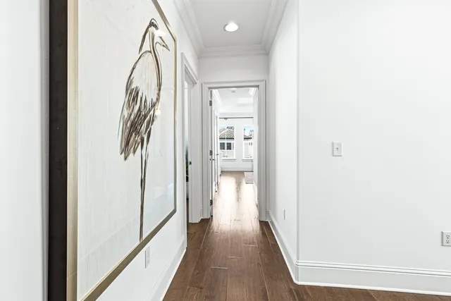 a spacious bedroom with a bed and a flat screen tv