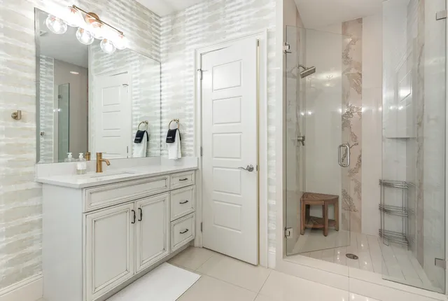 a front view of house with yard and trees around