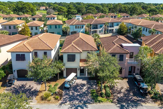 a front view of a house with yard and patio