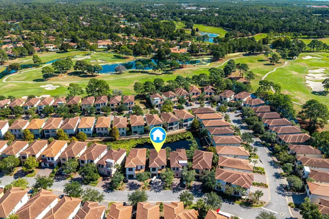 a view of a house with swimming pool and sitting area