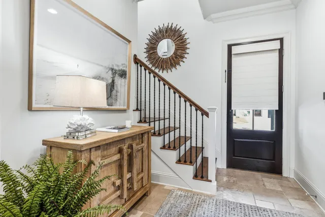 a view of a hallway with seating area