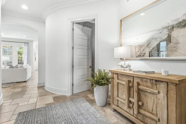 a view of a kitchen with furniture and a potted plant