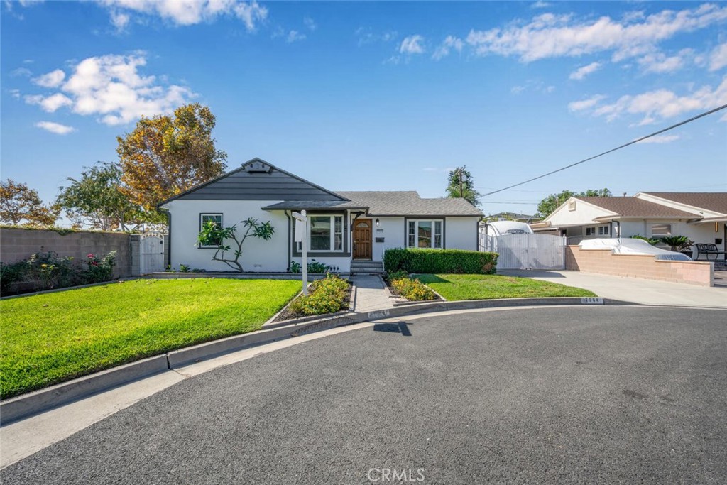 7964 Comolette Street Downey, CA 90242 - Photo 17 of 22 a house with swimming pool in front of it