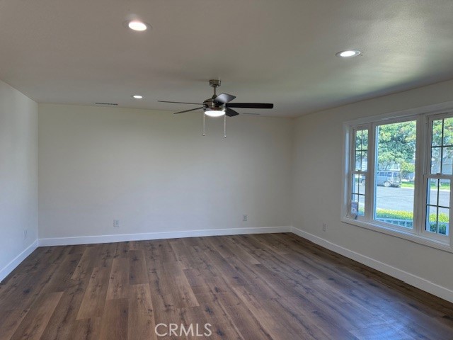 7964 Comolette Street Downey, CA 90242 - Photo 9 of 22 wooden floor in an empty room with a window