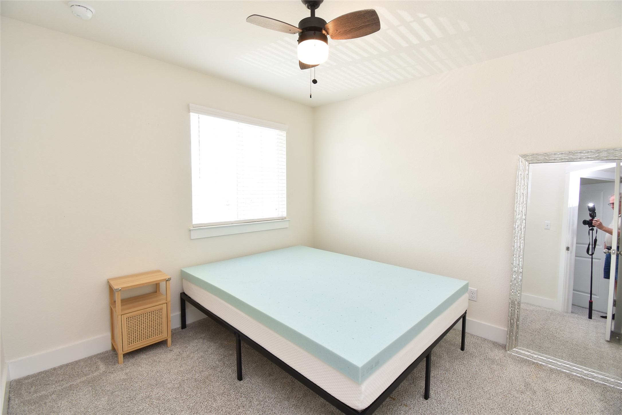 331 Alamar Knot Way, Unit 208 Georgetown, TX 78626 - Photo 6 of 17 A comfortable bedroom with soft carpeting and an overhead ceiling fan for optimal airflow.