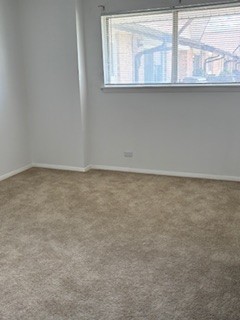 22 A Kingery Quarter, Unit 202 Willowbrook, IL 60527 - Photo 11 of 14 an empty room with a window