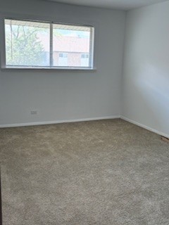 22 A Kingery Quarter, Unit 202 Willowbrook, IL 60527 - Photo 13 of 14 an empty room with a window