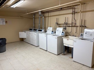 22 A Kingery Quarter, Unit 202 Willowbrook, IL 60527 - Photo 14 of 14 a utility room with dryer and washer