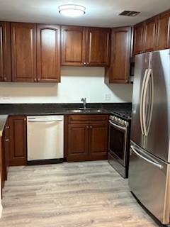22 A Kingery Quarter, Unit 202 Willowbrook, IL 60527 - Photo 3 of 14 a kitchen with stainless steel appliances granite countertop a stove a sink dishwasher and a refrigerator