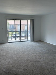 22 A Kingery Quarter, Unit 202 Willowbrook, IL 60527 - Photo 5 of 14 a view of an empty room with a window