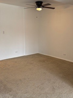 22 A Kingery Quarter, Unit 202 Willowbrook, IL 60527 - Photo 6 of 14 an empty room with a workbench