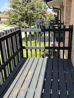 a view of a balcony with wooden floor