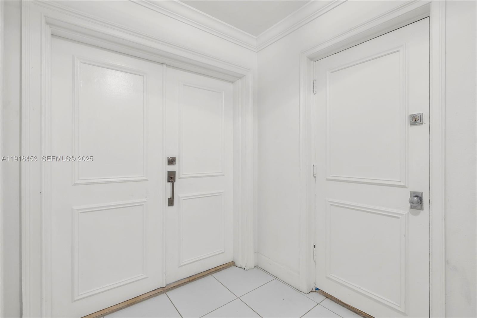 605 Ocean Drive, Unit 2L Key Biscayne, FL 33149 - Photo 34 of 46 PRIVATE HALL, DOUBLE DOOR ENTRANCE PLUS SERVICE DOOR TO KITCHEN