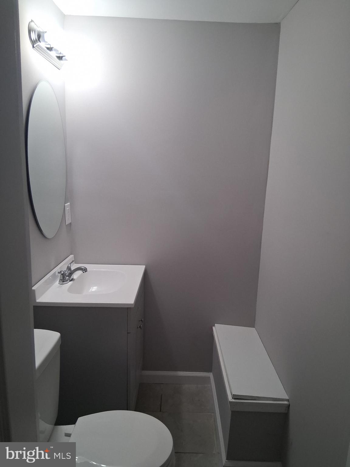 7 May Avenue New Castle, DE 19720 - Photo 15 of 21 a bathroom with a toilet sink and mirror
