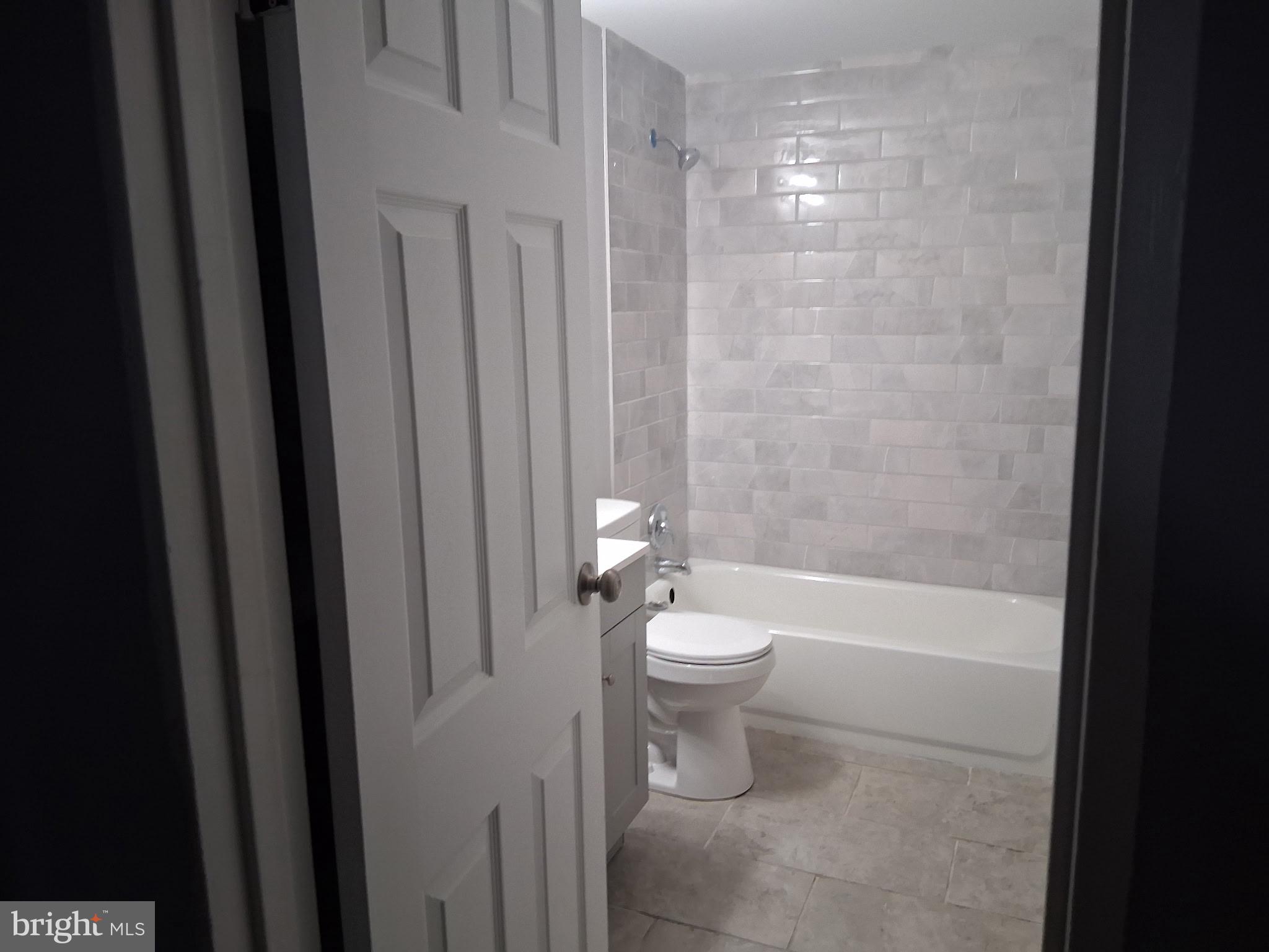 7 May Avenue New Castle, DE 19720 - Photo 20 of 21 a bathroom with a toilet a sink and bathtub