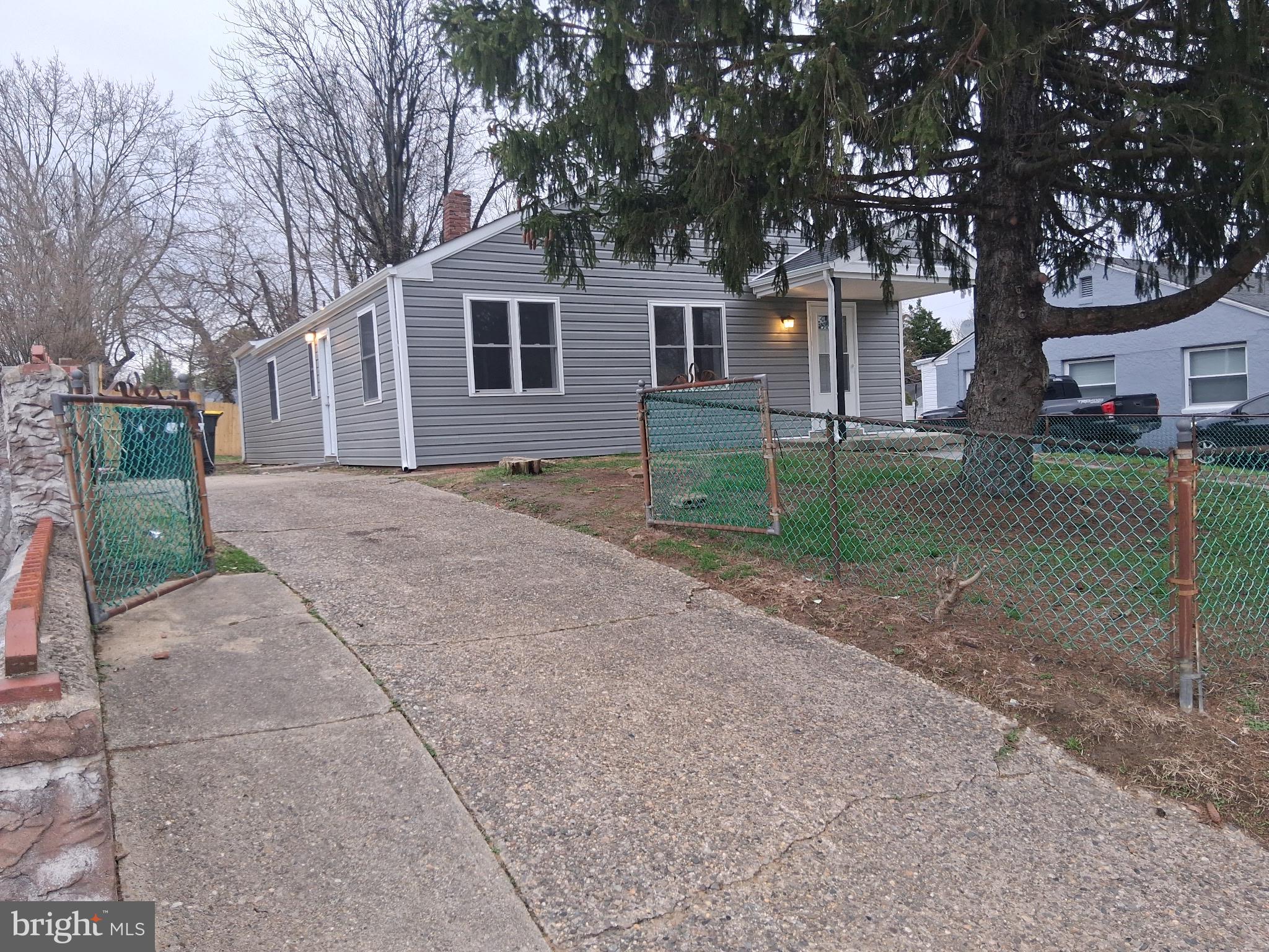 7 May Avenue New Castle, DE 19720 - Photo 3 of 21 a view of a house with a yard and large tree