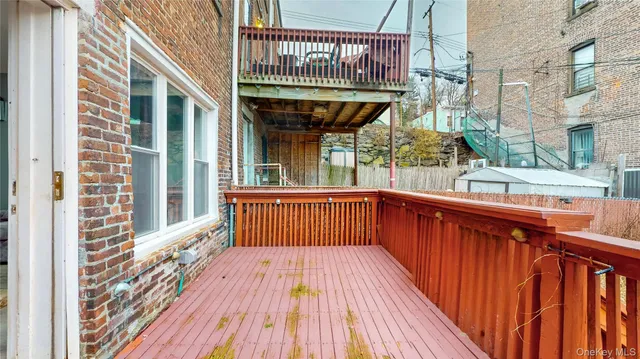 a view of balcony with wooden floor