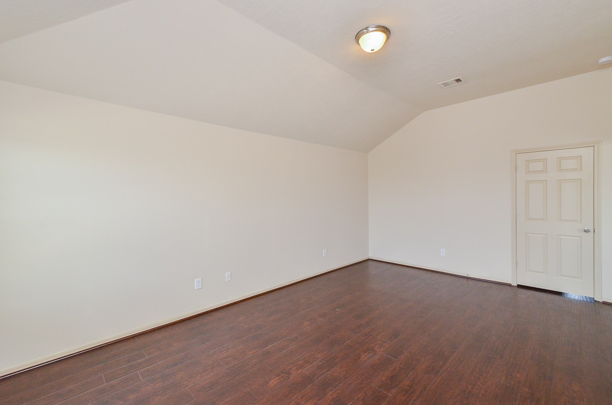 25135 Ginger Ranch Drive Katy, TX 77494 - Photo 19 of 32 Primary Bedroom: A large primary bedroom with wood-style flooring, neutral tones, and generous wall space for flexible furniture placement.