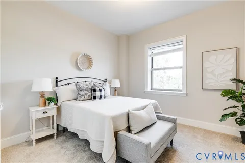 a bedroom with a bed and window