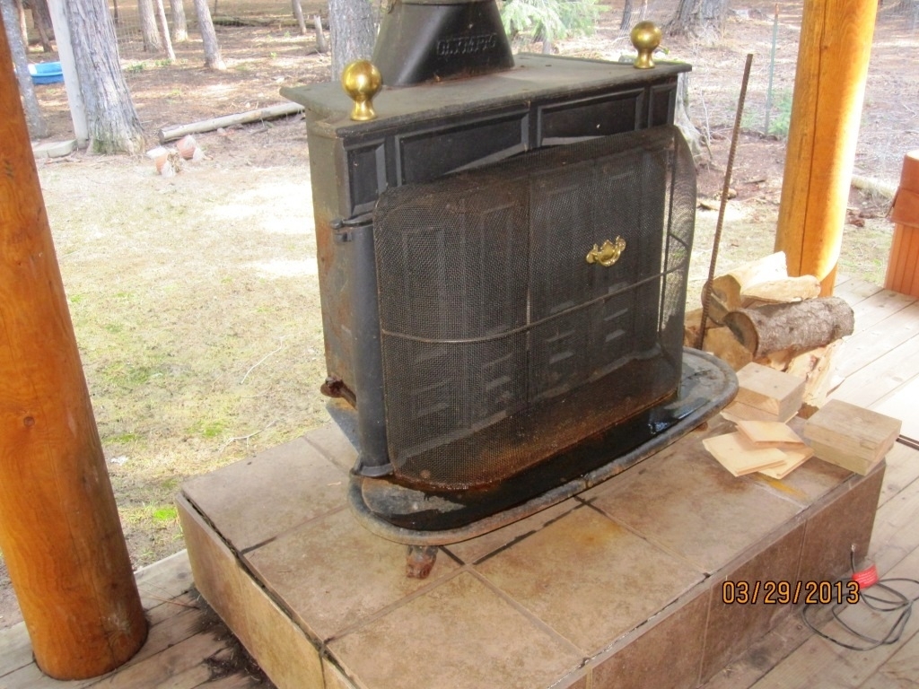 8567 Lake McCumber Road Shingletown, CA 96088 - Photo 30 of 39 back porch wood stove