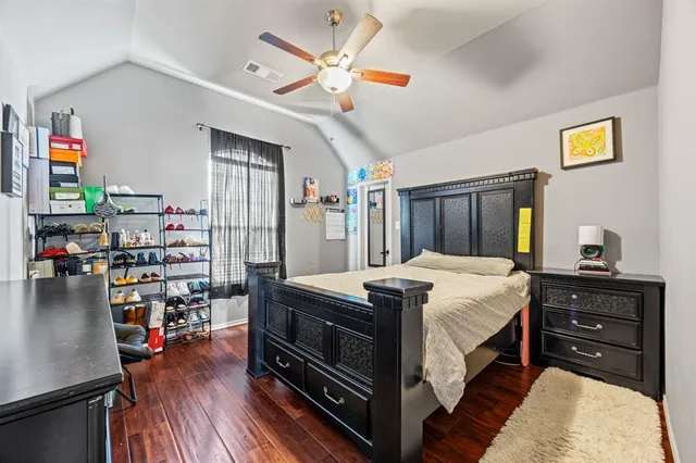 a bed room with a bed and a chandelier