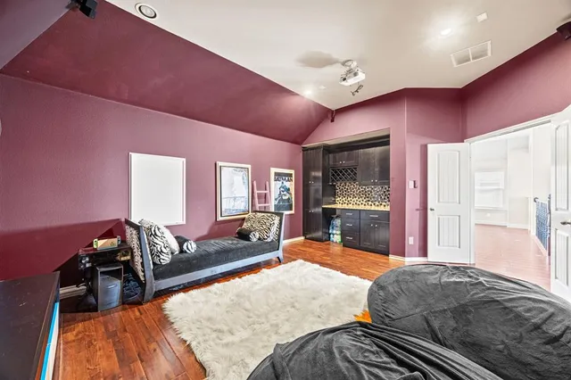 a bed room with a bed and furniture