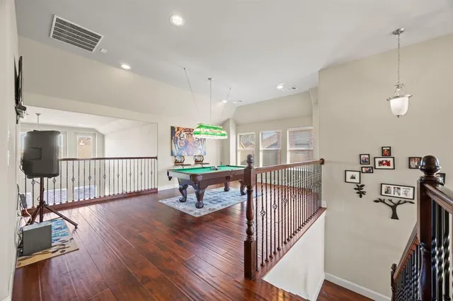 a view of a livingroom with furniture and hardwood floor