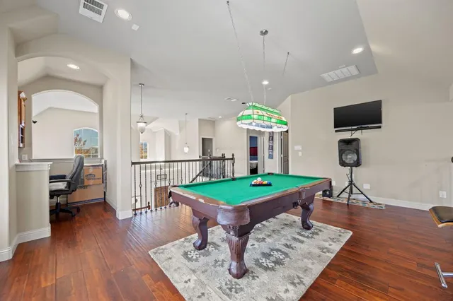 a room with furniture wooden floor and a table