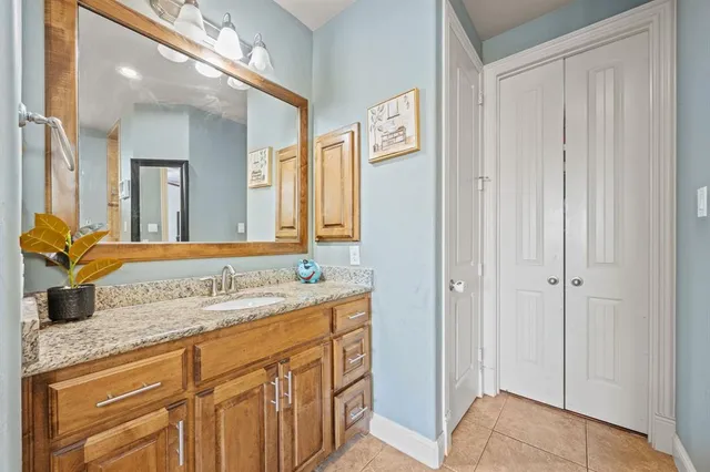 a bathroom with a sink a vanity and a mirror