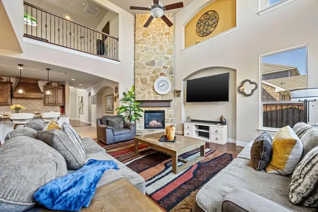 a living room with furniture and a fireplace