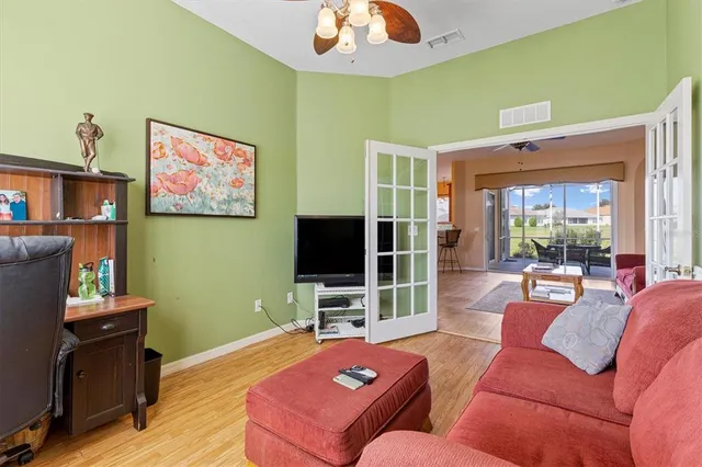 a bedroom with furniture and a window