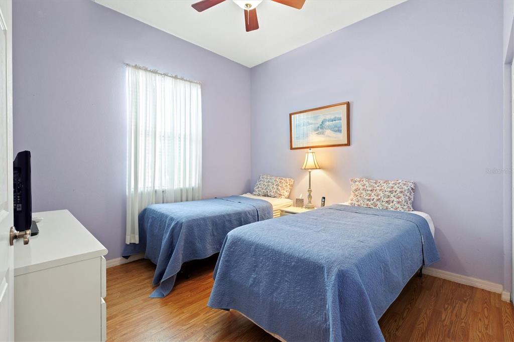 17739 Southeast 121st Terrace Road Summerfield, FL 34491 - Photo 17 of 48 a bedroom with two beds and a window