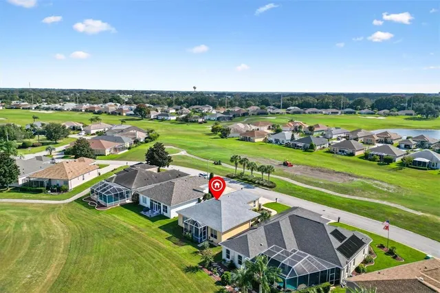 an aerial view of a house with a garden
