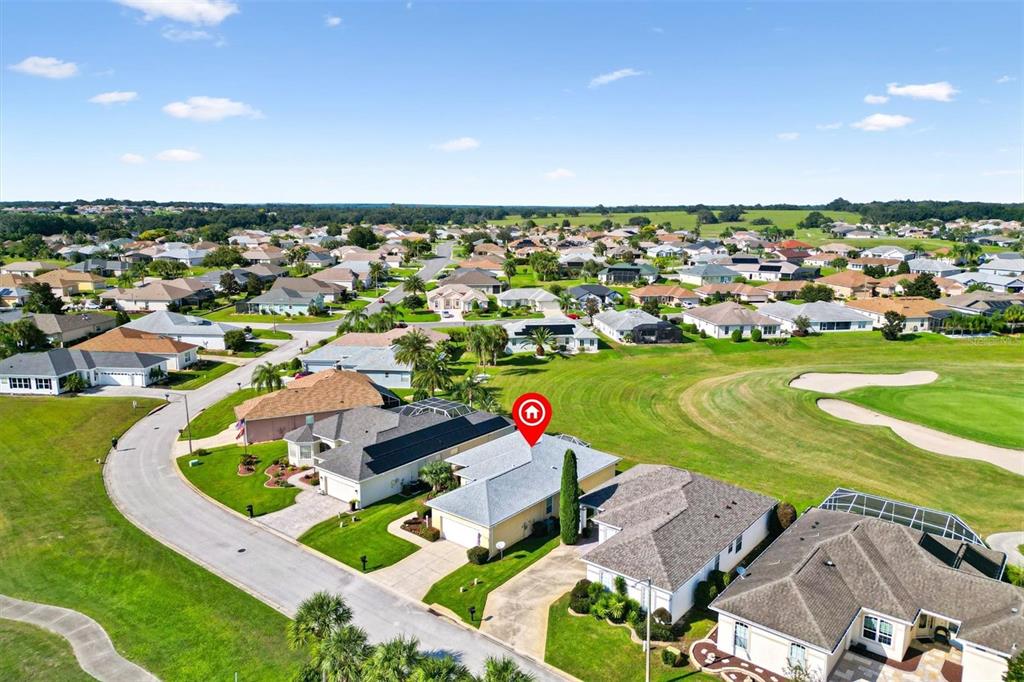17739 Southeast 121st Terrace Road Summerfield, FL 34491 - Photo 36 of 48 an aerial view of a house with a swimming pool yard and outdoor seating