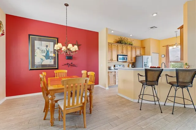 a living room with furniture a ceiling fan and a rug