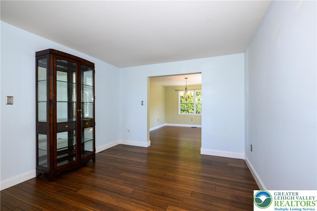1252 Center Street Coplay, PA 18037 - Photo 12 of 63 an empty room with wooden floor and entrance